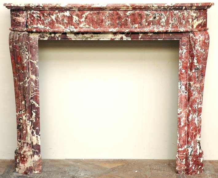 Louis_XVI_mantel_in_Fleur_de_Pecher_marble.jpg