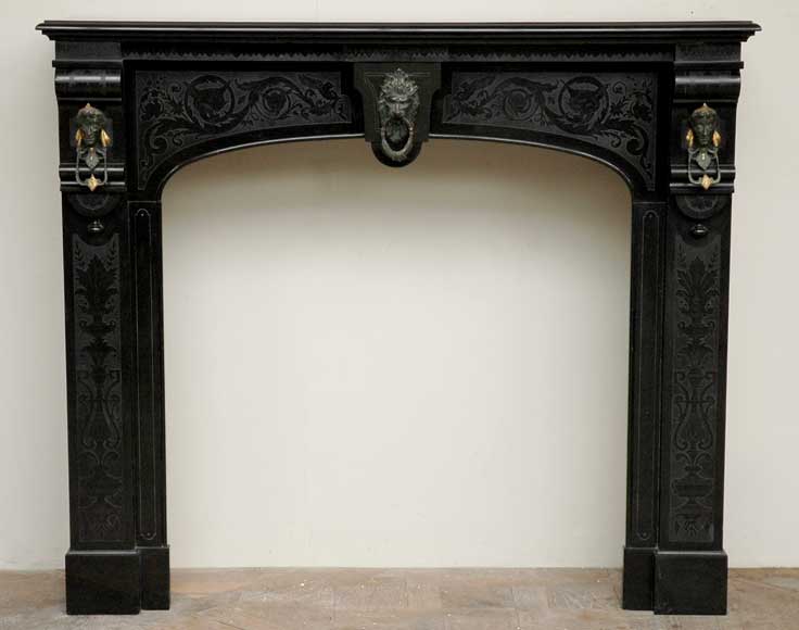 Black_Engraved_Marble_Mantel_with_bronze_heads.jpg
