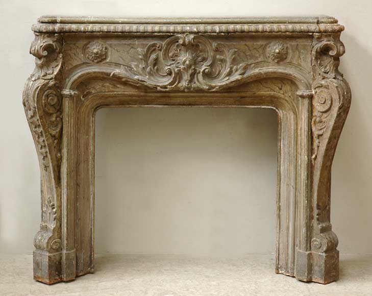 Rare_antique_mantel_in_cast_iron_with_oak_shelf.jpg