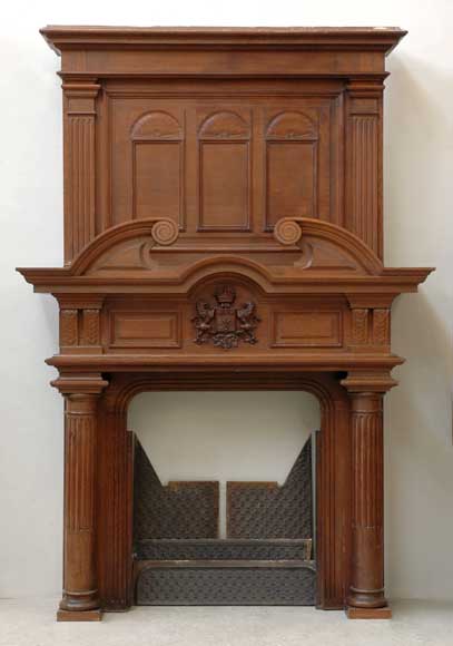 Antique_Oak_Mantel_with_columns_and_coat_of_arms.jpg