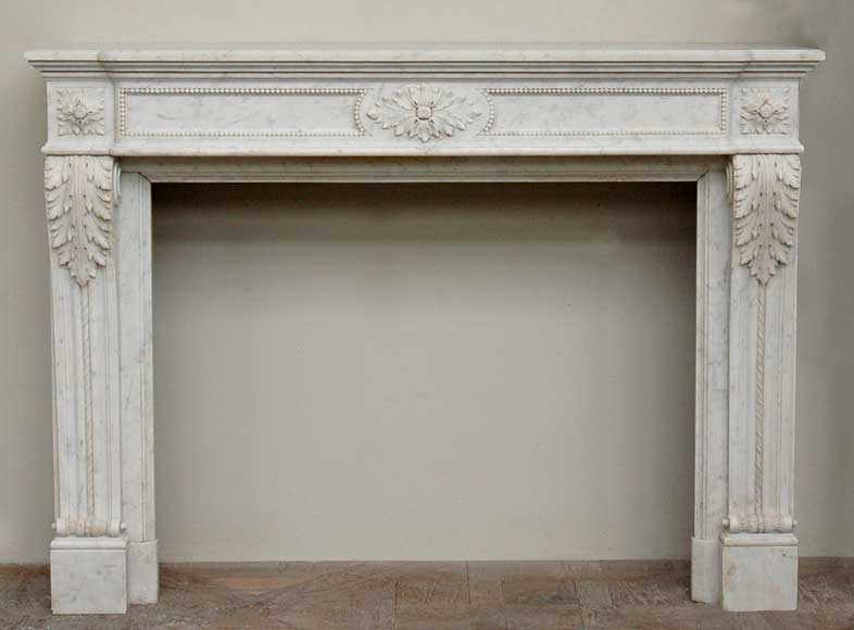Antique_mantel_in_the_Louis_XVI_style_in_Carrara_marble_.jpg
