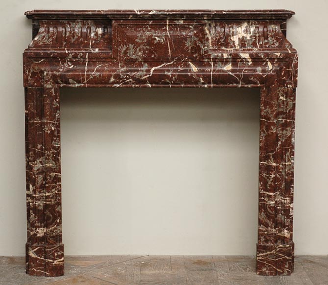 Antique_Louis_XIV_style_marble_mantel_with_acroterion.jpg