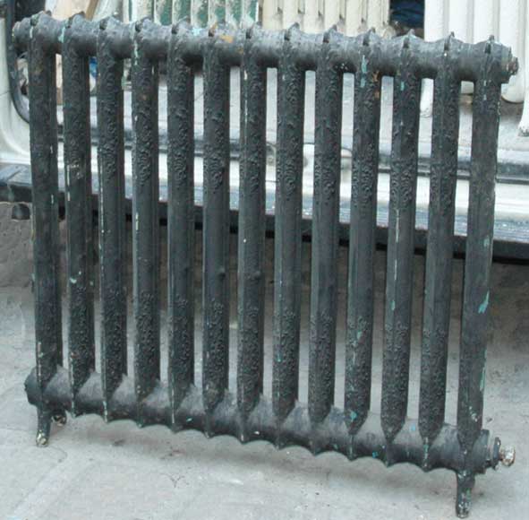Series_of_cast_iron_radiators_with_curlicue_designs.jpg