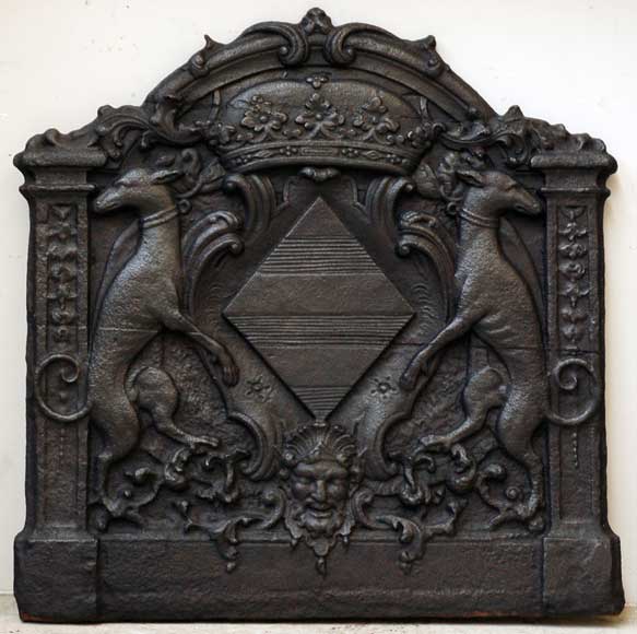 Cast_iron_fireback_with_arms_of_Louise_Renee_de_Penancoet_de_Kerouaille.jpg