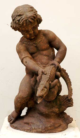 Cast_iron_fountain_with_putto_and_caiman.jpg