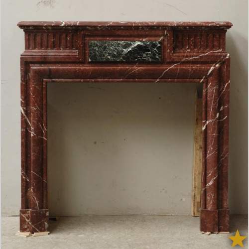 Камин в стиле Людовика XIV из Красного мрамора Норд с инкрустацией.
