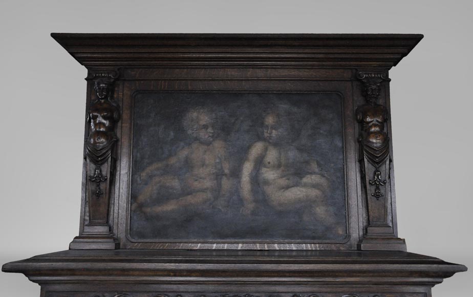 Старинный дубовый камин в стиле Неоренессанса, украшенный картиной с двумя ангелочками.-1